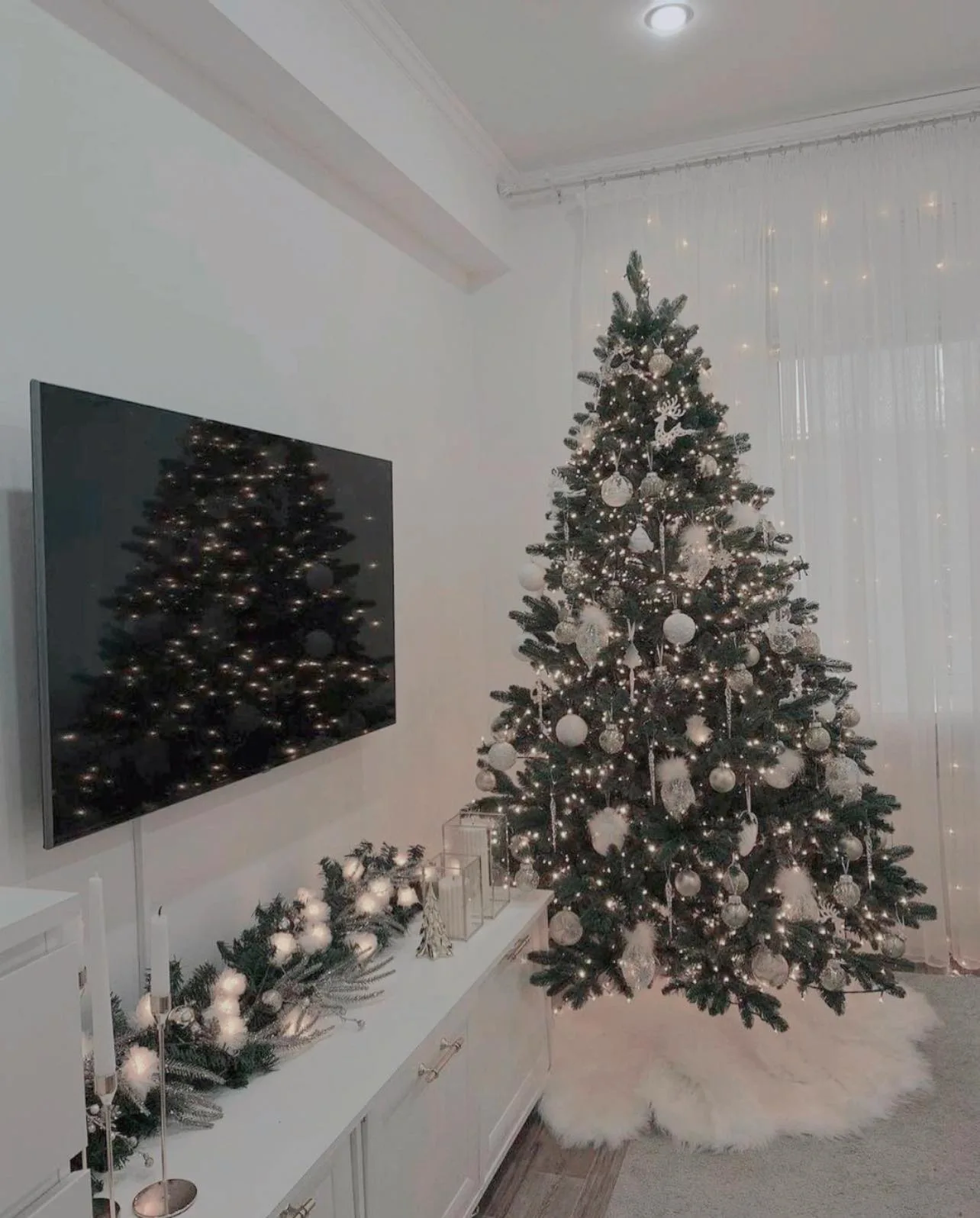 Decorated Christmas tree in a soft white room